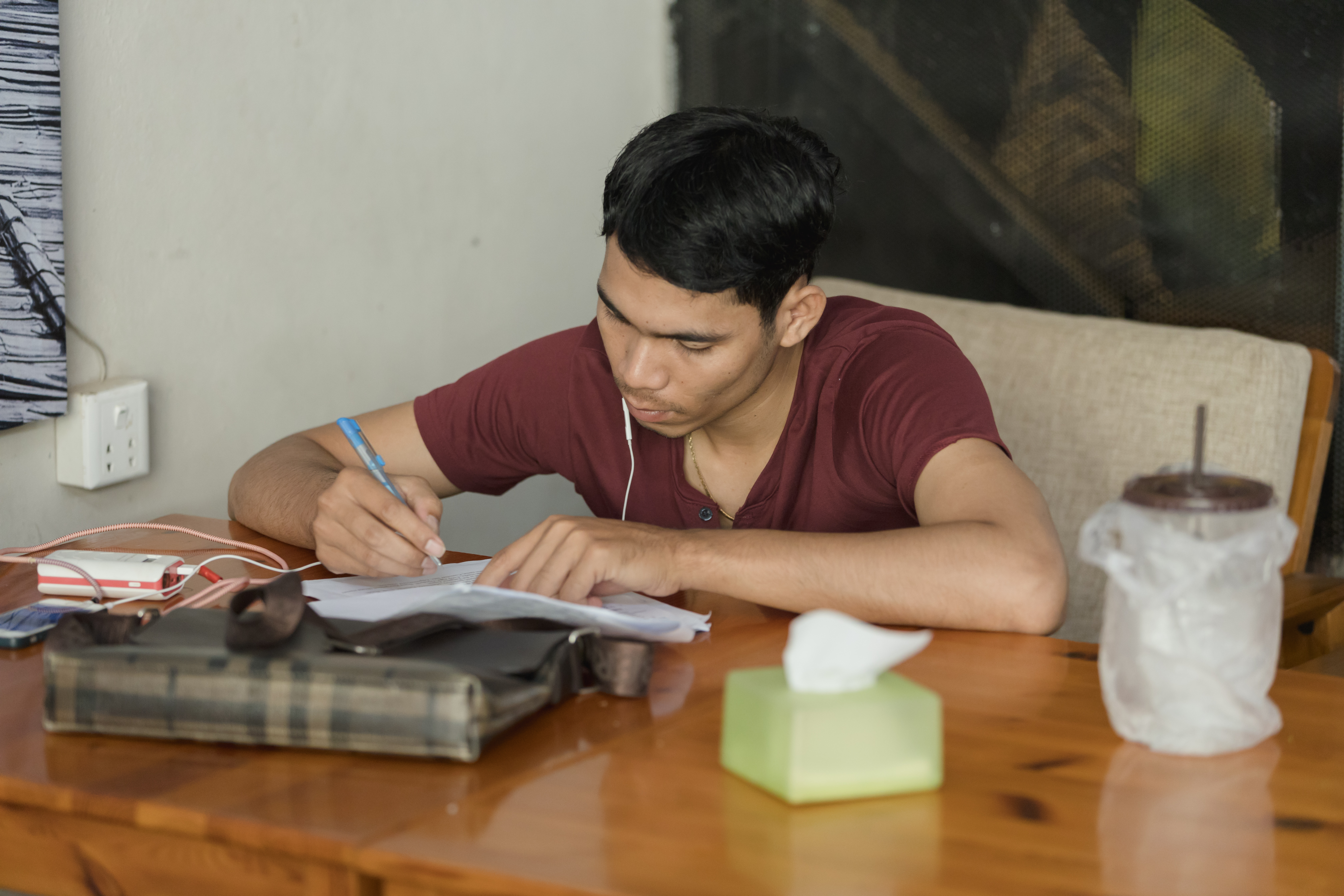 Photo of a student in Cambodia studying at the Global Student Centre.