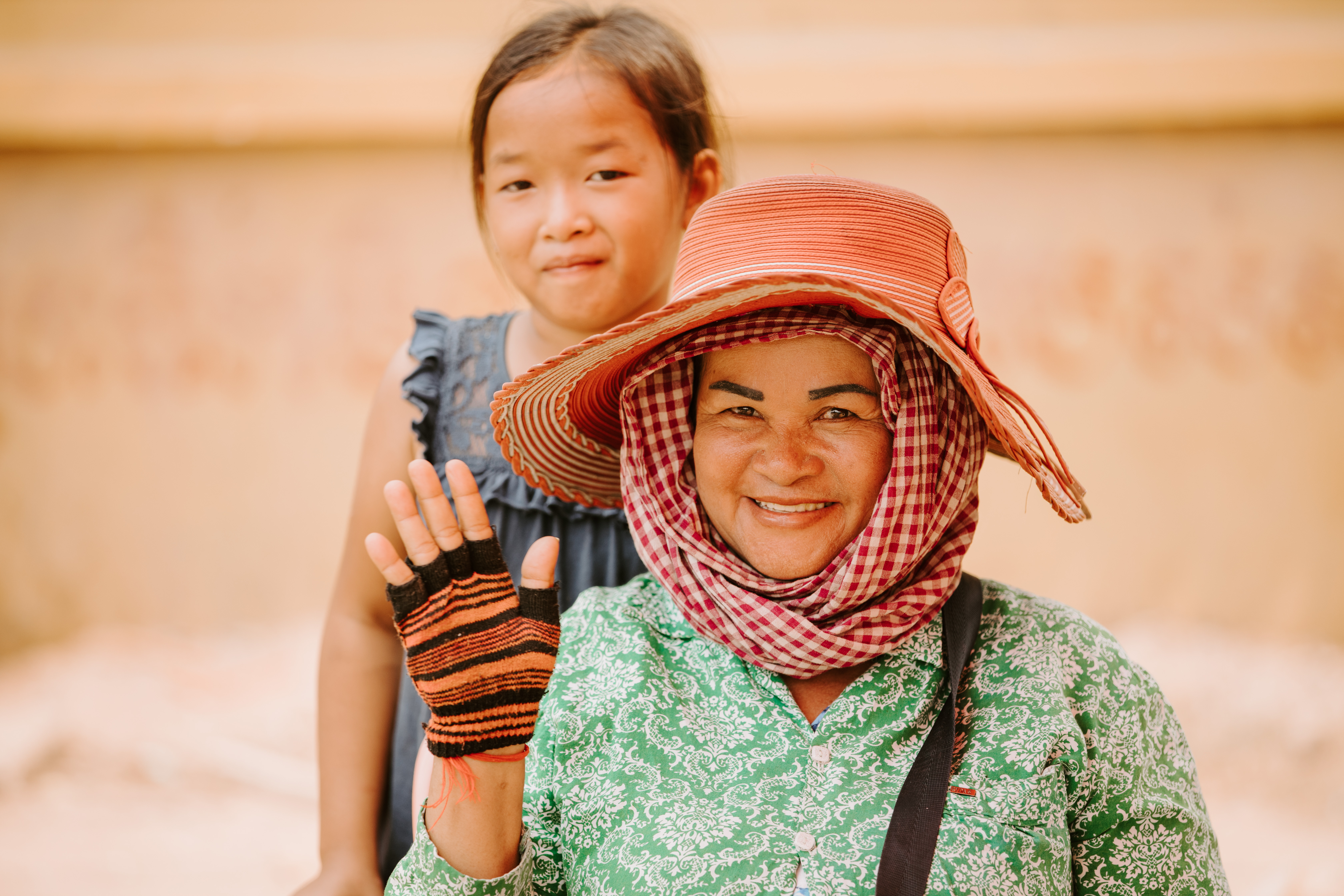 Photo of a mom and her daughter smiling at the camera from Cambodia