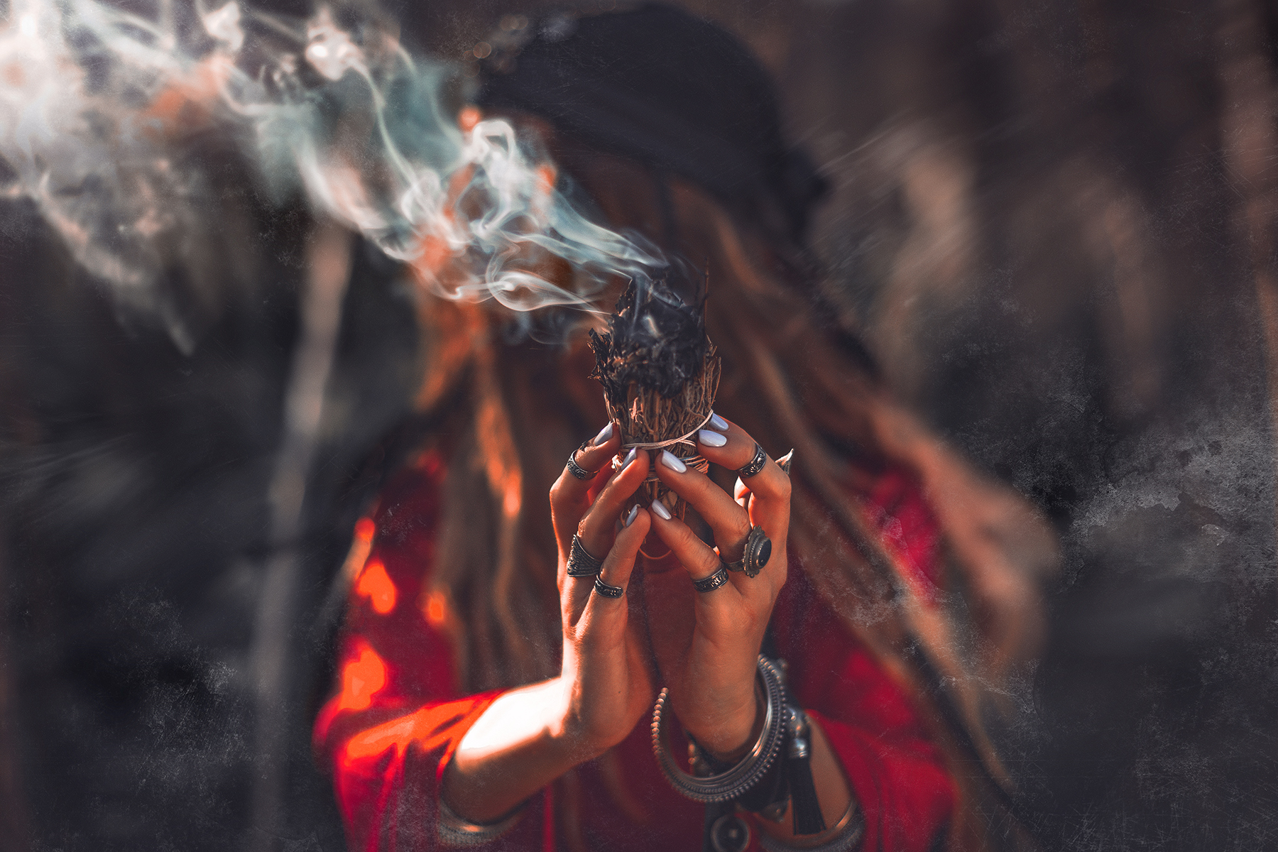 Photo of a lady burning smoke from Shutterstock.