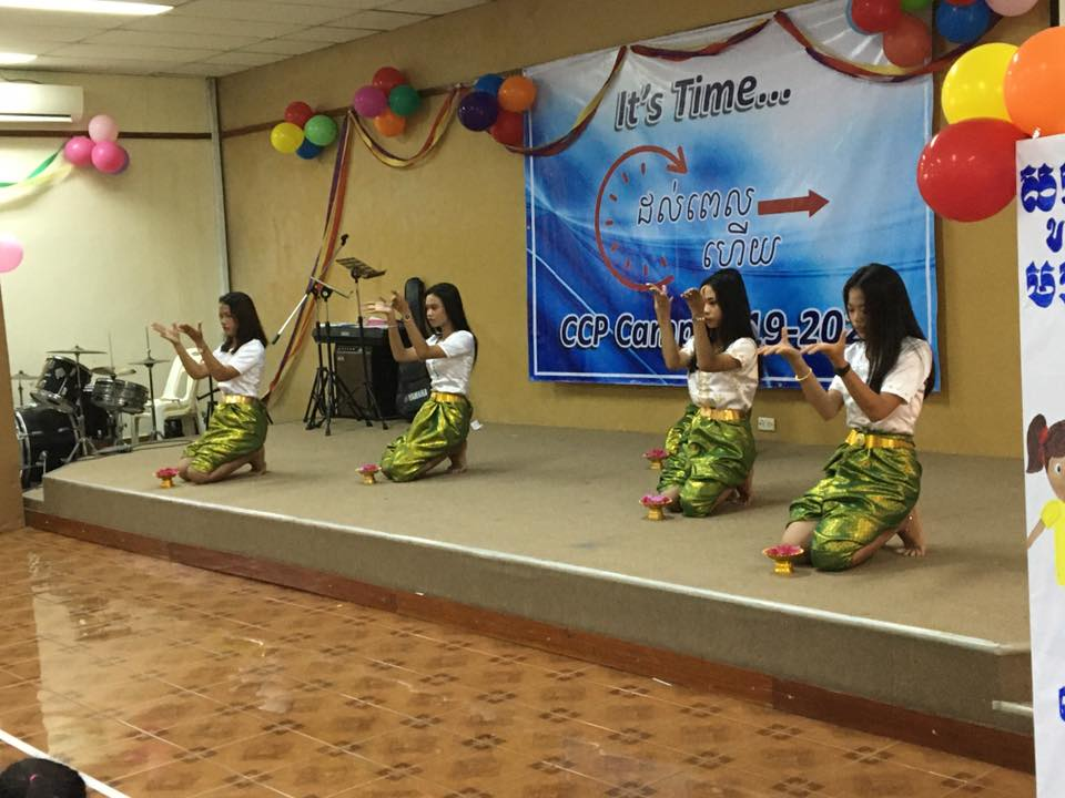 Photo of a group of young adult girls on stage at a ChildCARE Plus Sponsorship Camp in Cambodia