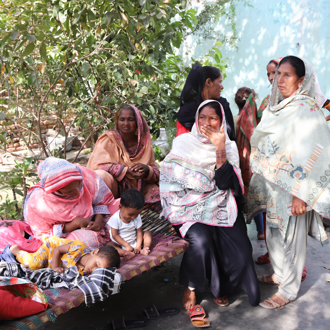 women and children resting in the street.