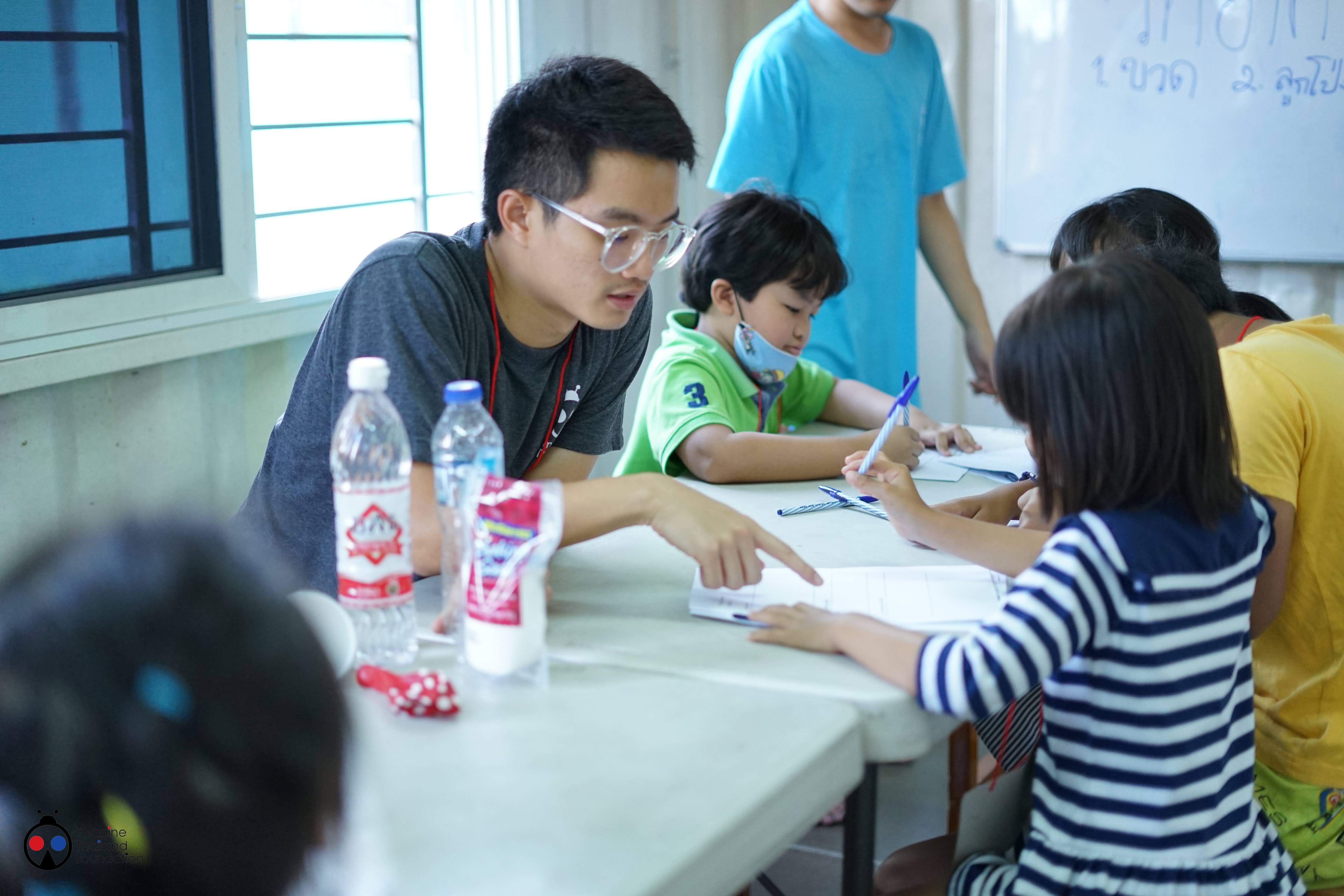 DSC03018 Boy teaching in asian context