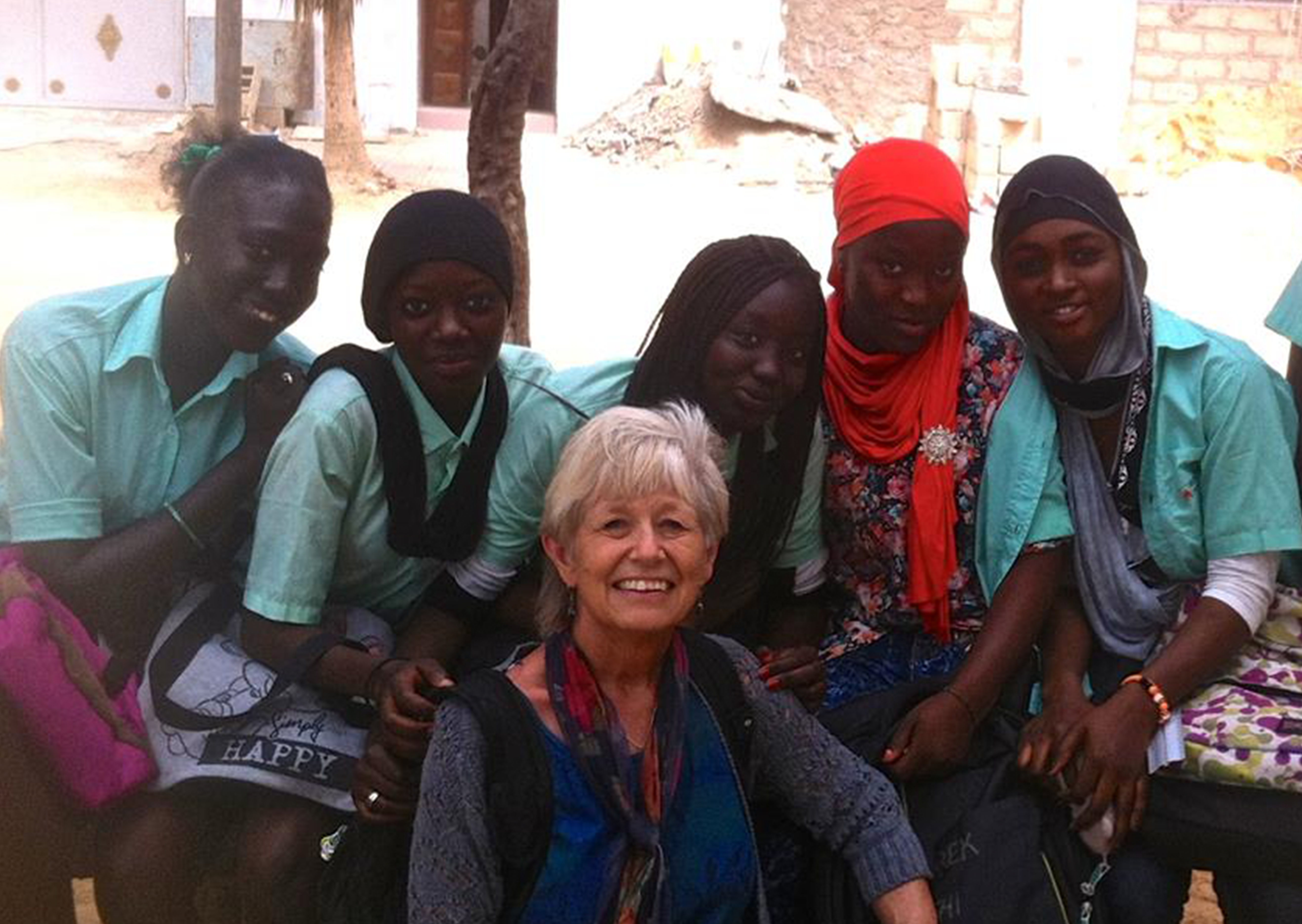 Photo of Judy Bowler with a group of girls in Guinea.