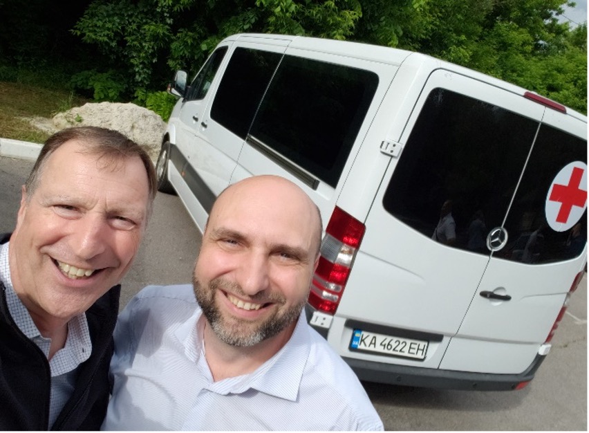 Photo of Steve Hertzog with Pastor Vadim & the van purchased with funds from Canada