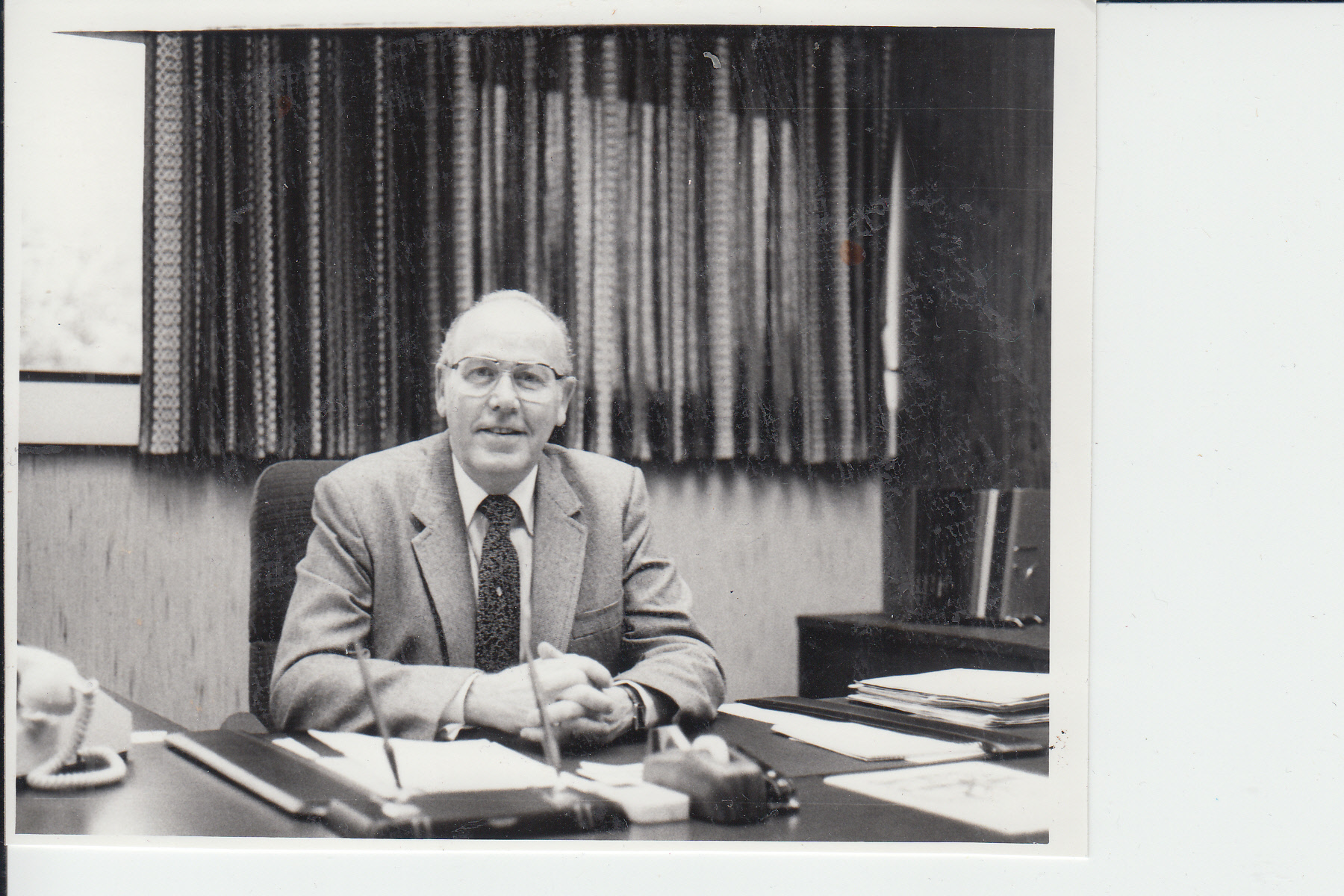 6 - Robert Taitinger at his desk in an undated photo.